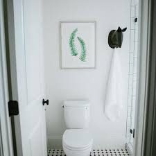 Instead of having a towel bar try some hooks! 9 Beautiful Bathroom Hooks For Every Style