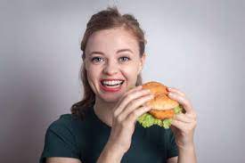 We are proud to be launching a new scholarship programme which will help female burger king employees pursue their culinary. Girl Eating Burger Stock Photos And Images 123rf