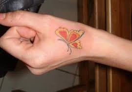 10 simple hand tattoo design for women pictures to pin on pinterest. Butterfly Hand Tattoo Design