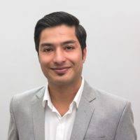 A man standing in front of a white wall. free photos free images.