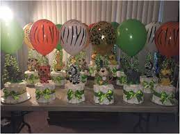 Foci cozi 148 pack jungle safari theme party decorations set：148 latex balloons, 12 green palm leaves, 1 banner 4 cake topper 16 feets arch balloon strip tape, 1 balloon tying tools safri party supplies favors for kids boys birthday baby shower decor. Shower Baby Boy Jungle Theme Baby Shower Table Decorations