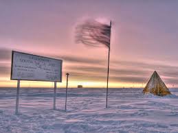 Take hold of his legs and lift him up the tree or pole; South Pole National Geographic Society