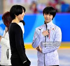 yuzuru hanyu of japan and cha junhwan of south korea talk during a practice session ahead of the figure skating gala exhibitio hanyu yuzuru hanyu figure skater