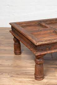 Earthing, grounding cabinets and chests designed to energize and balance our homes, the range of antique arches, rustic carved doors, barn doors and antiques including carved door panels,columns, arches, carved screens, cabinets and consoles are definitely a class apart. Antique Sheesham Wood Indian Palace Door Made Into Coffee Table With Iron Studs At 1stdibs