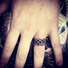 18 Lovely Wedding Ring Tattoos That Symbolize Your Love 2019 Tattoo Wedding Rings Ring Tattoo Designs Wedding Ring Tattoo For Men