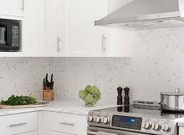 .inset cabinets, white cabinets, marble countertops, white backsplash, stone slab backsplash, stainless steel appliances and an island how the piece of example of a transitional kitchen pantry design in los angeles with shaker cabinets and white backsplash vent option for above cabinetry. Backsplash Ideas With White Cabinets Novocom Top