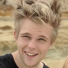 Who can remove asbestos from venting in a ceiling in the West GR area?