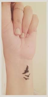 Birds In Flight Tattoo Meaning Pin By Melissa Swope On Tattoo Ideas Wrist Tattoos For Women Tattoos For Daughters Bird Tattoo Wrist