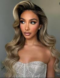 Who are some recommended hair and makeup artists in the Houston area for  weddings?