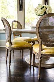 Hand crafted from naturally grown rattan. Round Marble Top Dining Table With Round Cane Back Chairs And Yellow Seat Cushions Transition Round Back Dining Chairs Dining Room Seating Dining Room Chairs