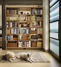 This bookshelf was designed by sigmar, along with the ladder. How To Design A Cohesive Bookshelf Seattle Met