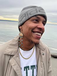 Amari Davis (they/them) HELD by Amari