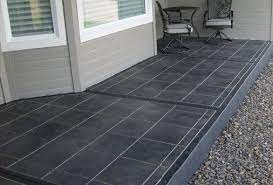 Red brick is the masonry of choice for the front porch along with white columns and a bronze metal porch roof. Pin By David Parsons On Patio Painted Concrete Slab Paint Concrete Patio Painted Patio Painted Concrete Floors