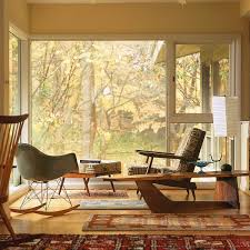 The stacked decorative area rugs are the main part of the room which creates a decorative nuance. Mid Century Modern Furniture Inspiring Retro Style Interiors Deavita