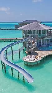 Water Villa With Slide Would You Slide Down This In The Maldives Honeymoon Weddingplanning Sonevaj In 2020 Water Villa Beautiful Places To Travel Dream Vacations
