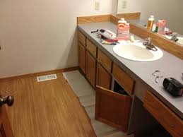 Protect the surrounding area by placing painters paper (or painters plastic) around the edges of your vanity. Refinishing A Wood Bathroom Vanity Part 1 Preparation Stripping