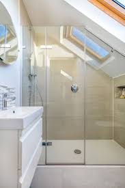 Brass fixtures and a mosaic stone tile floor add charm to the white bathroom. Breathtaking Attic Bathroom Ideas Bathroom Remodel Loft Bathroom Small Attic Bathroom Sloped Ceiling Bathroom