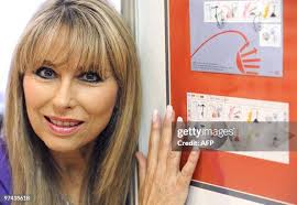 Artist Susan Woolf poses