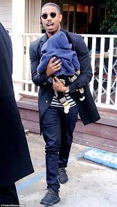 Michael jordan is a former professional american basketball player, olympic athlete, businessperson and actor. Creed S Michael B Jordan Cuddles A Friend S Baby In Los Angeles Daily Mail Online