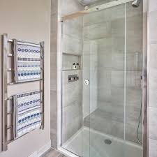 Gray bathroom accents colors because gray is a neutral, earth tone paint color, it can be dulling when used exclusively. Modern Grey Bathroom Makeover With Separate Shower And Bath