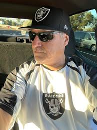 What percentage of people wear Raiders gear to work today?
