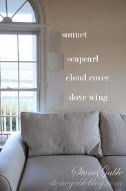The custom front door leads to an open layout home. Benjamin Moore Paint Color Wicker Exterior Paint Color Home Ideas