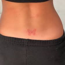 Red Ink Butterfly Tattoo On The Lower Back Tattoo Butterfly Tattoo Butterfly Tattoo Red Ink Tattoos Small Tattoos