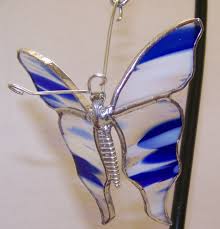 Hanging definition, the act, an instance, or the form of capital punishment carried out by suspending one by the neck from a gallows, gibbet, or the like, until dead. Hanging Butterfly With Stained Glass Wings Blue White Clear The Avenue Stained Glass