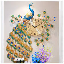 Peacock, on behalf of wealth and auspicious, is a good sign for your family. Smc Wall Clock Simple Modern Peacock Clock European Home Living Room Quiet Atmosphere Wall Clock Quartz Clock Buy Online In Sri Lanka At Desertcart Lk Productid 104421306