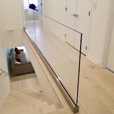 What goes into setting up a stairway will typically reflect the general theme that this home or office will often have. Update Your Hallway Glass Panel Railing Opens Up A Narrow Hallway And Helps Create A Fresh Clean And Beau Glass Staircase Railing Railing Design Stairs Design