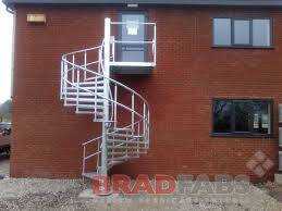 Exit stairs that continue beyond the level on which the exit discharge is located must be interrupted at that level by doors, partitions, or other effective means that clearly indicate the direction of travel. Steel Fabricators Of Balconies Staircases Spiral Staircase Fire Escape Steel External Staircase External Access Stairs Steel Spiral Staircase In Bradford Fabricated And Delivered Throughtout The Uk