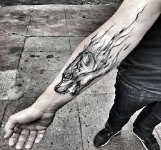 The forearm is a great spot for elongated or vertical tattoos. Awesome Looking Black Ink Forearm Tattoo Of Wolf Head By Inez Janiak Tattooimages Biz