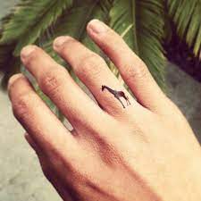 Tiny Giraffe Tattoo Giraffe Tattoos Cute Finger Tattoos Body Art Tattoos