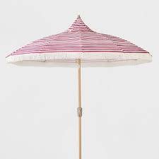Target teamed up with heritage footwear and clothing brand hunter on an exclusive (and affordable!) collection of men's, women's and children's apparel, and accessories. Your Patio Area Should Be As Lively And Energetic As You Are Which Is Why You Ll Love Sitting Under This 9 Foot Strip Patio Umbrella Opalhouse Market Umbrella