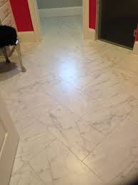 12 X 24 Carrara Look Porcelain Tile In Herringbone Pattern Herringbone Tile Floors Flooring Tile Floor