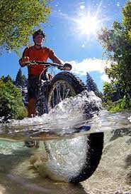 Half Underwater View Of A Mountain Biker Crossing A Stream New Zealand Photo By Chris Mclennan Bike Ride Mountain Biker Mountain Biking