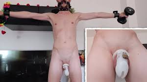 Naked submissive boy does home workout with chastity cage and mouth gag