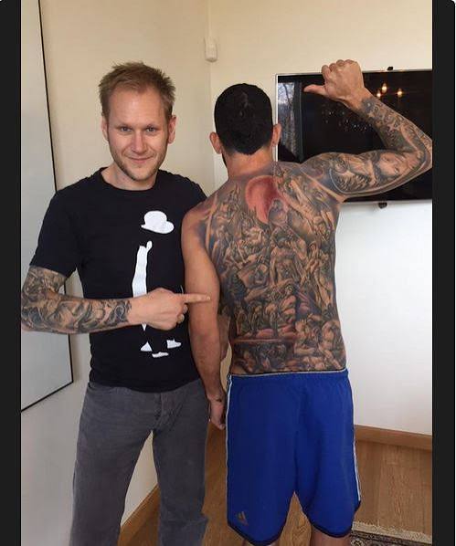 Carlos Tevez detailed arm tattoo