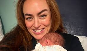 Tadhg Fleming's baby girl watches him in football match