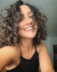 Basically, hair stylists recommend keeping curly hair on its longer side, since the weight contributes to taming still, there are many types of curls, from soft to kinky, from thin to bushy, and, thus, there is a plethora of hairstyles for curly with an eye toward your hair type, scroll through our photo gallery. 4 Chic Wavy Curly Hairstyles To Try This Summer Idea Huntr