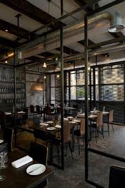 Exposed Piping And Wiring Coupled With Raw Steel And Concrete Floors Give The Space An Industrial F Restaurant Interior Bar Design Restaurant Restaurant Design