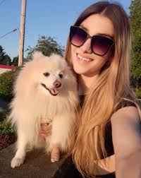 Smiling mom in white jeep at Petoskey Pediatrics
