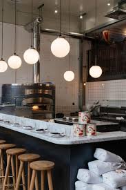 Radio Alice Shoreditch Italian Pizza Restaurant In London With White Marble Hig Al Open Kitchen Restaurant Restaurant Kitchen Design Kitchen Bar Design
