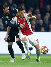 Dusan Tadic Of Ajax Competes For The Ball With Sergio Ramos Of Real Sergio Ramos Uefa Champions League Sports Images