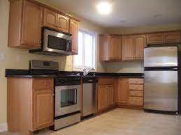Maple Cabinets Kitchen Cabinets Stainless Steel Appliances Granite Countertops Raised Panel Microhood Microwave Kitchen Kitchen Remodel Kitchen Cabinets
