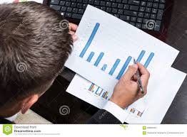 Businessman Studying Charts Stock Image Image Of Hand