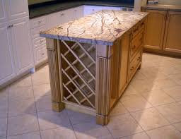 It has a rectangular top with a same shape inset in a lighter tone, brass cornerpieces, low angular feet. Continental Kitchen Design Inc Diy Kitchen Island Building A Kitchen Wine Rack Design