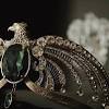 It was a locket of heavy gold with a serpentine s in glittering green stone inlay on the front. 3