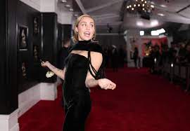 Miley cyrus, like a lot of disney stars, has more or less grown up in front of our very eyes. Miley Cyrus In Black Jumpsuit At Grammys 2018 Red Carpet Dress Liam Hemsworth Supporting Miley From Afar For Grammys