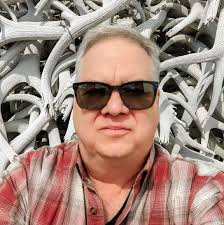 What is the location of the Woodlawn Midway building?